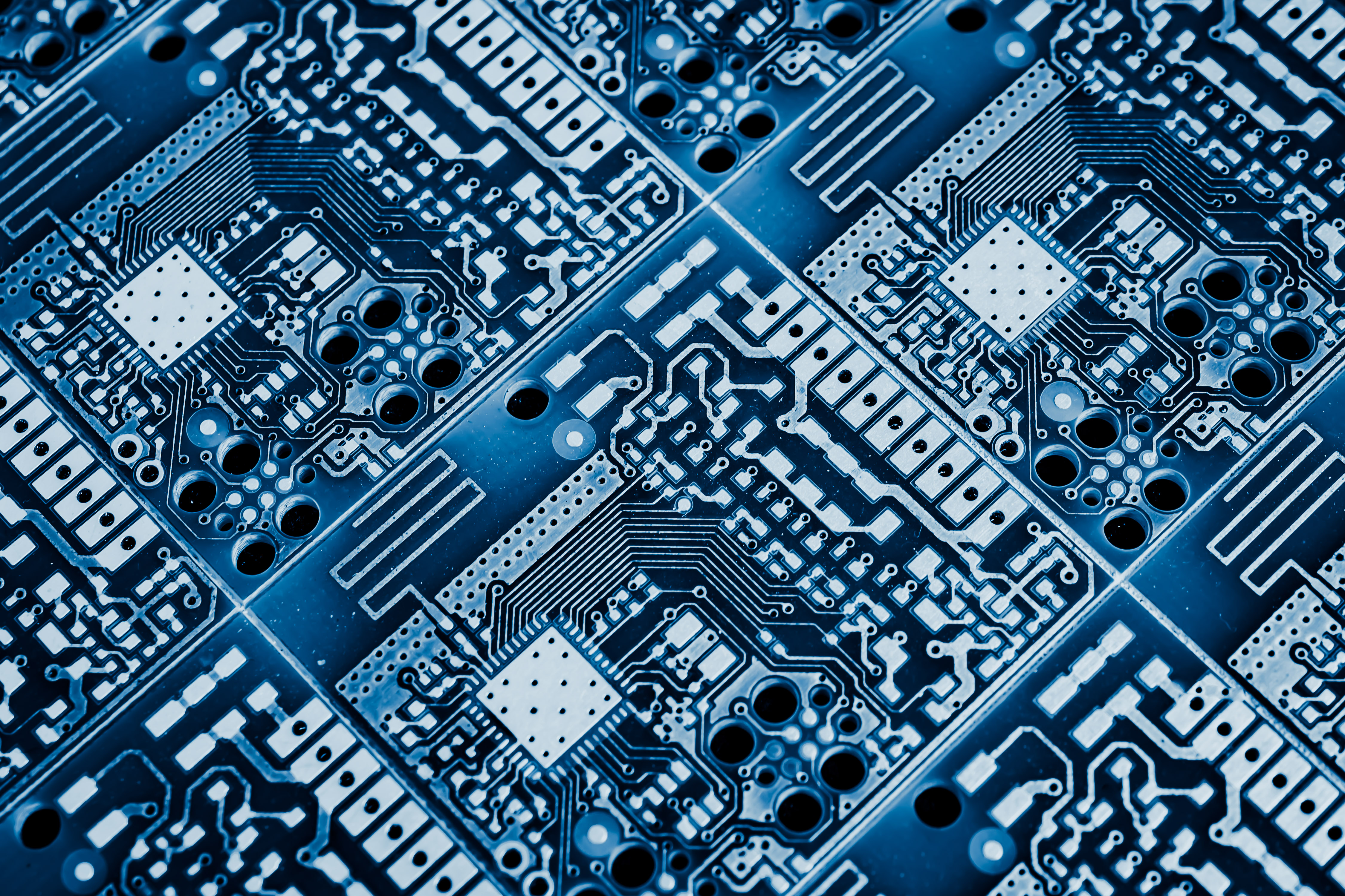 Close-up of a blue circuit board with gold contacts